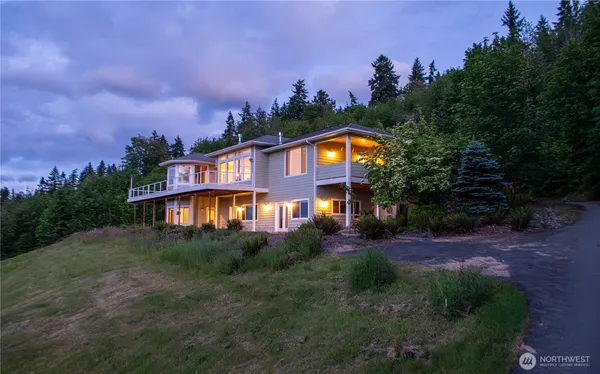 a front view of a house with a yard and a yard