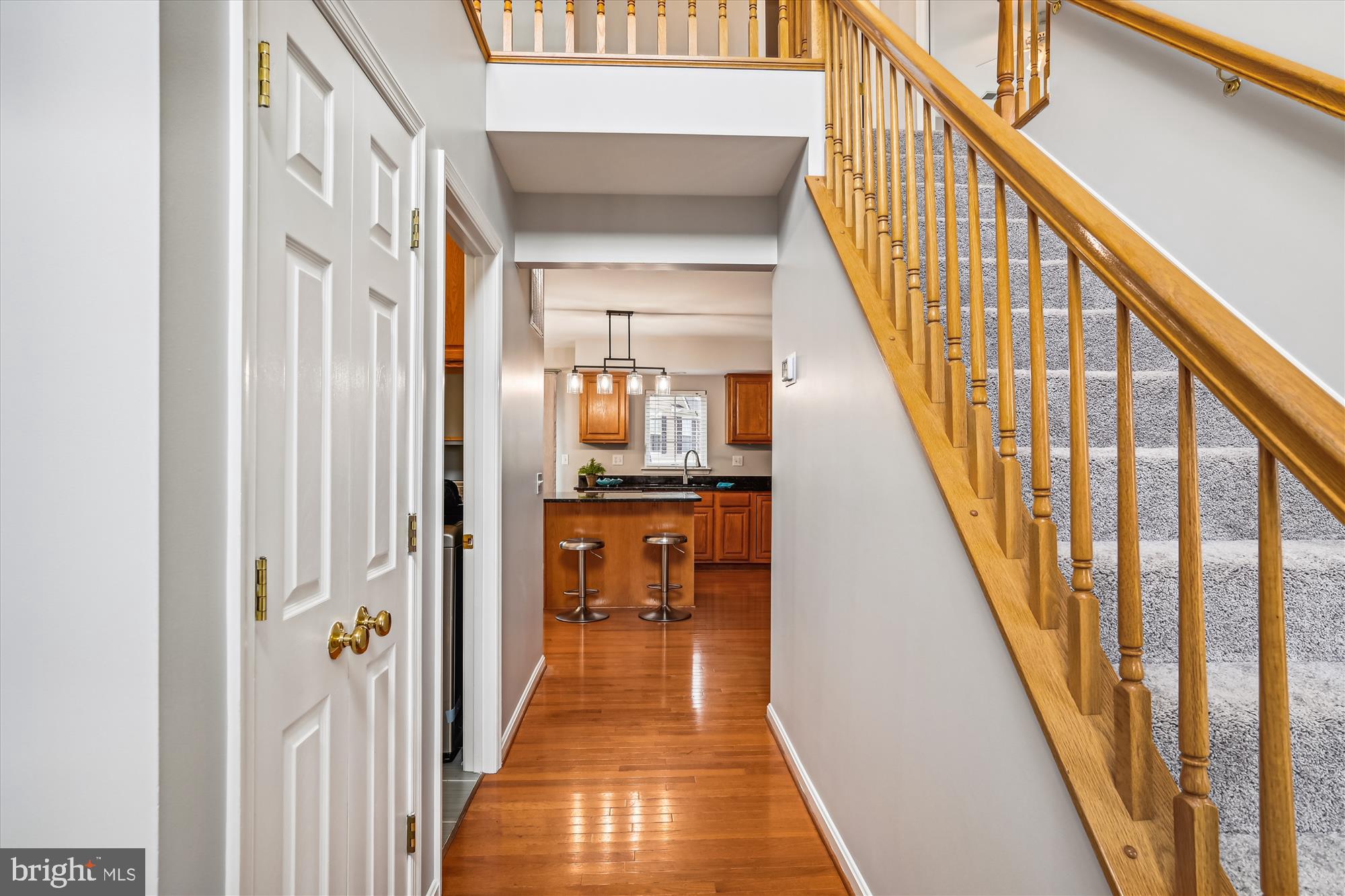 5958 Florey Road Hanover, MD 21076 - Photo 33 of 77 a view of a hallway with wooden floor and staircase