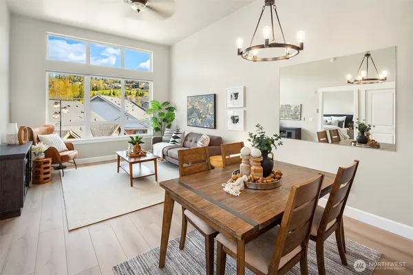 a view of a dining room with furniture window and outside view
