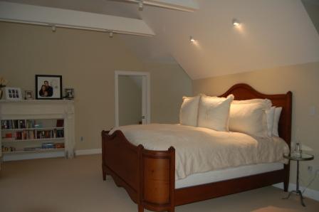 1 Hemlock Road Tyringham, MA 01264 - Photo 13 of 19 a spacious bedroom with a bed and a fireplace