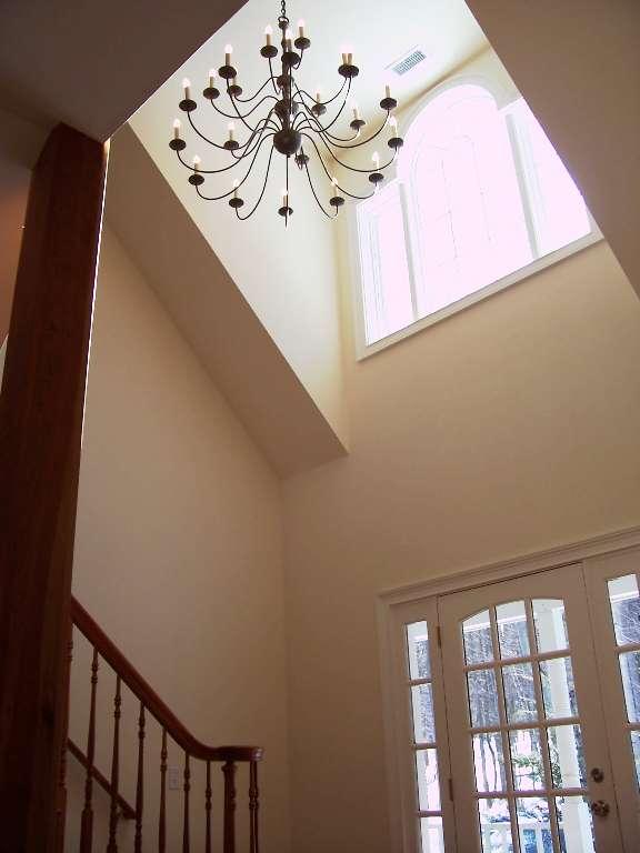 1 Hemlock Road Tyringham, MA 01264 - Photo 3 of 19 a view of a hallway with a chandelier
