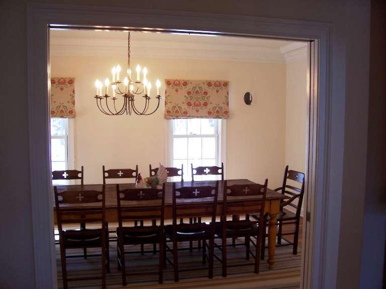 1 Hemlock Road Tyringham, MA 01264 - Photo 8 of 19 a view of a dining room with furniture a chandelier and wooden floor