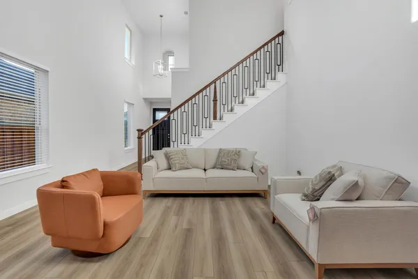 a living room with furniture and a window