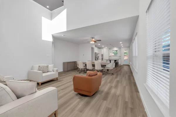 a view of a dining room with furniture window and wooden floor
