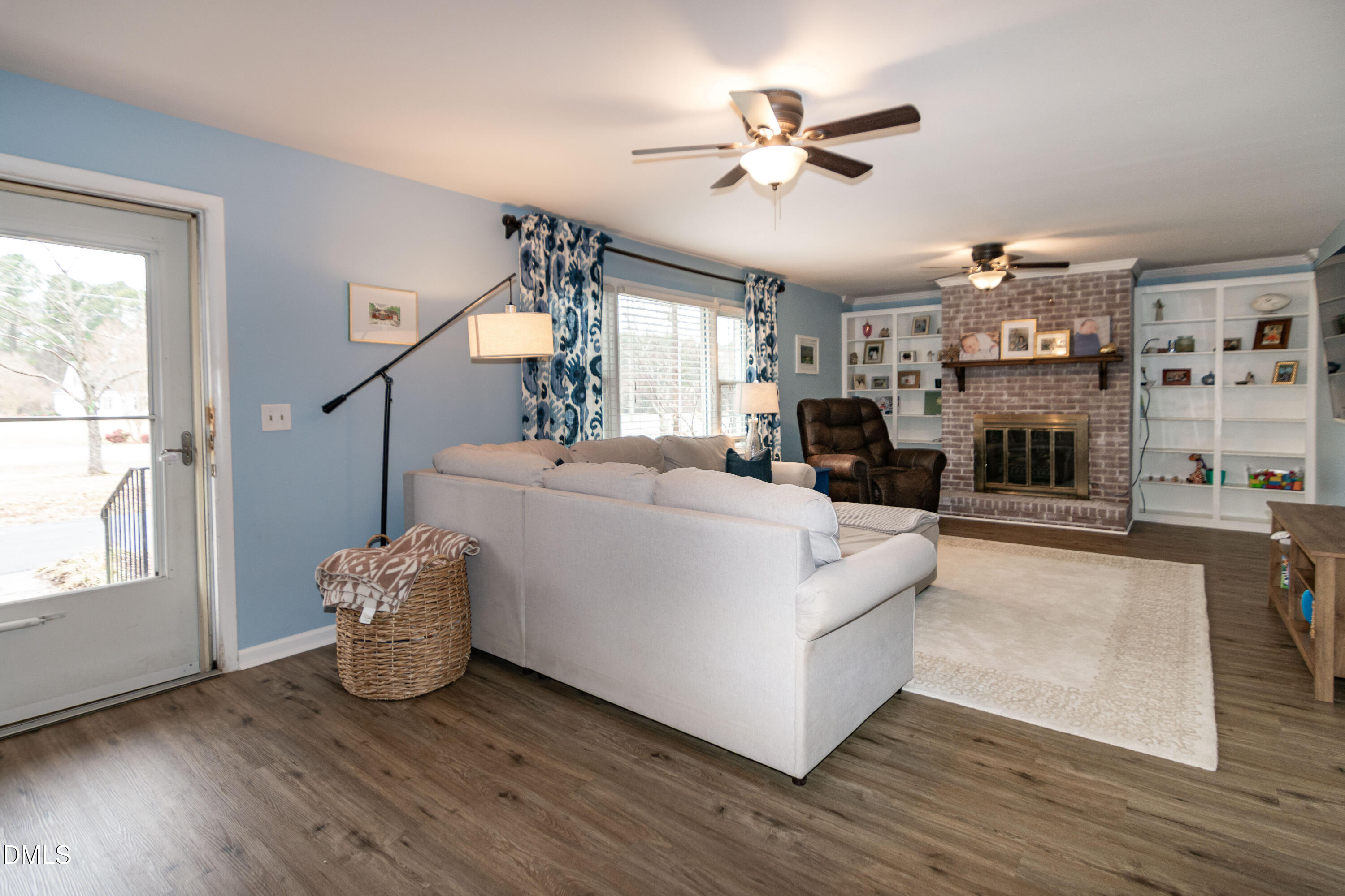 1009 Old Ferrell Road Knightdale, NC 27545 - Photo 11 of 42 a living room with furniture and a chandelier