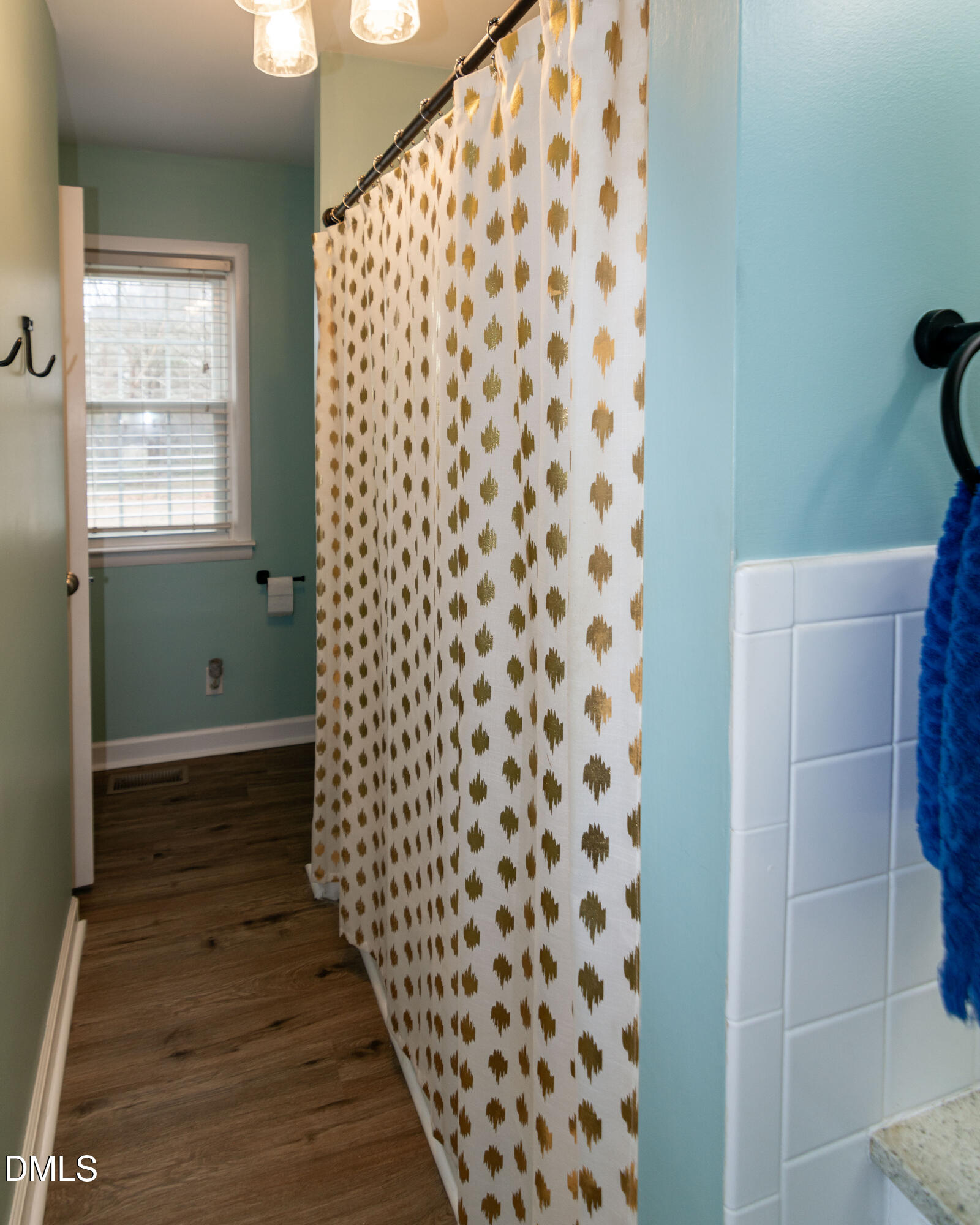 1009 Old Ferrell Road Knightdale, NC 27545 - Photo 20 of 42 a bathroom with a shower curtain