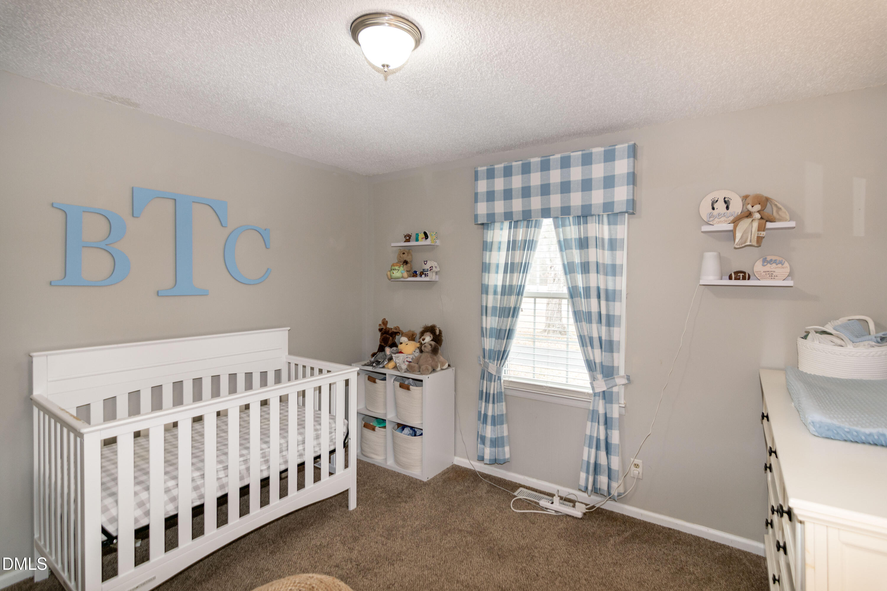 1009 Old Ferrell Road Knightdale, NC 27545 - Photo 24 of 42 a bedroom with a bed and a window