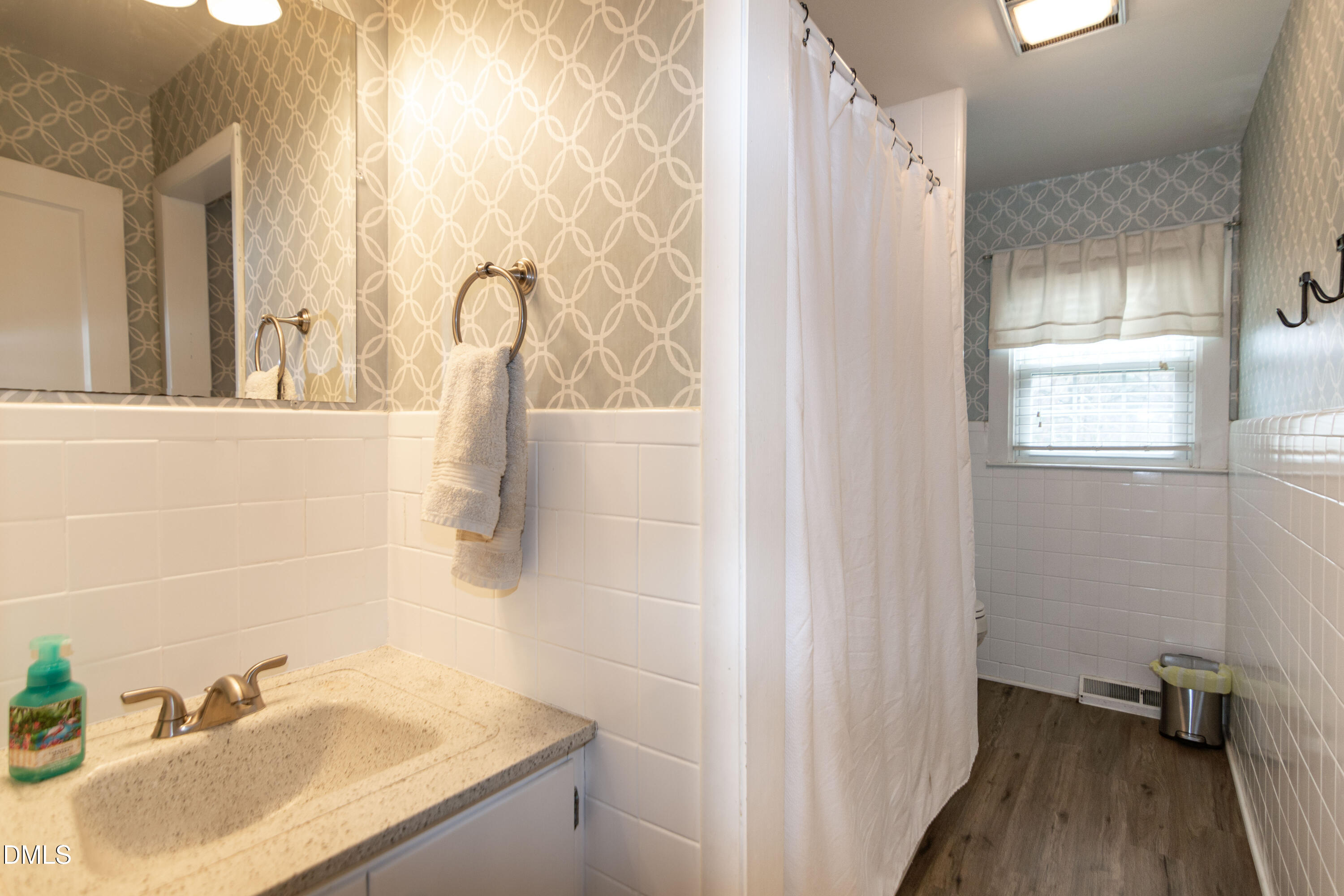 1009 Old Ferrell Road Knightdale, NC 27545 - Photo 27 of 42 a bathroom with a granite countertop sink and a mirror