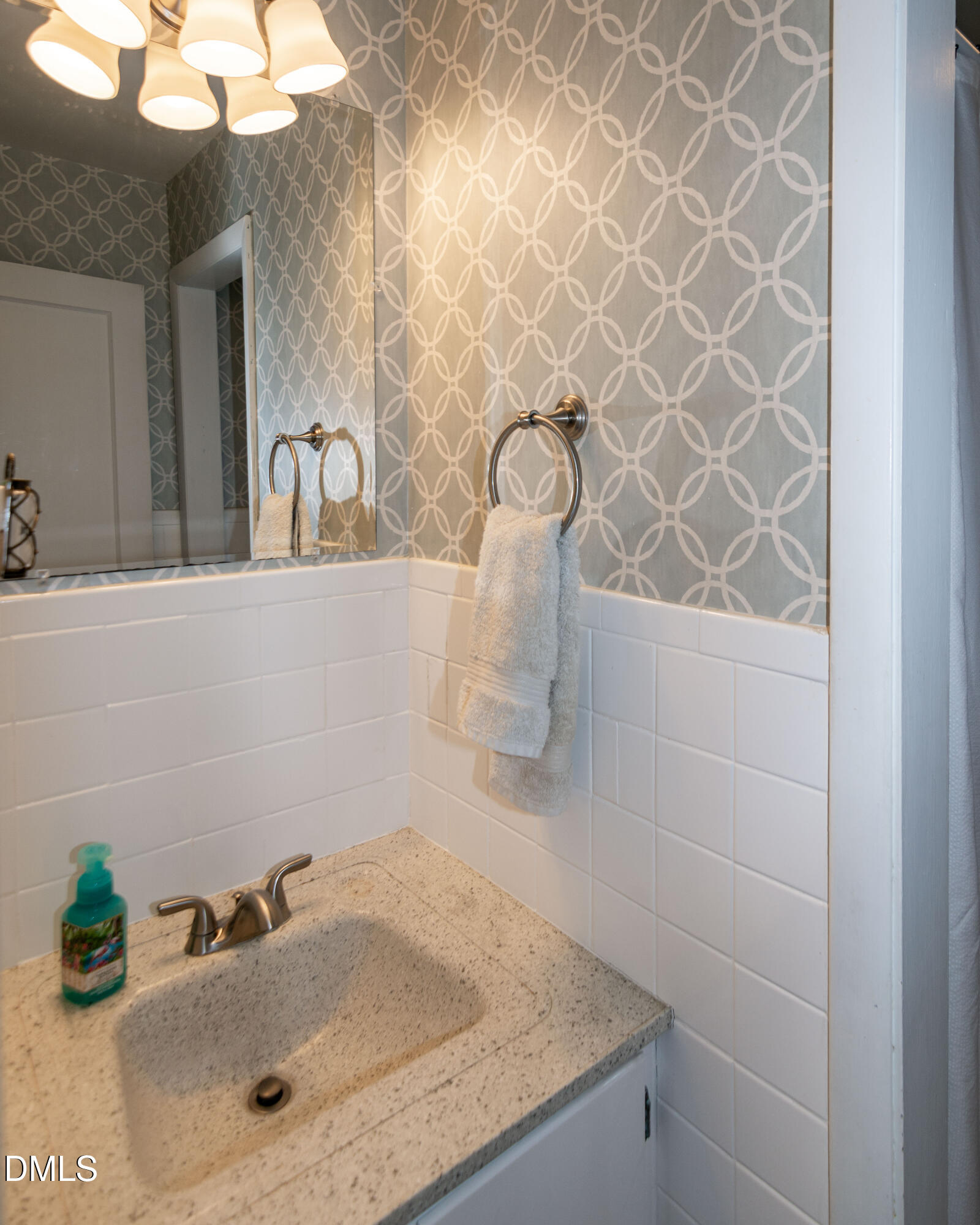 1009 Old Ferrell Road Knightdale, NC 27545 - Photo 28 of 42 a bathroom with a sink and a mirror