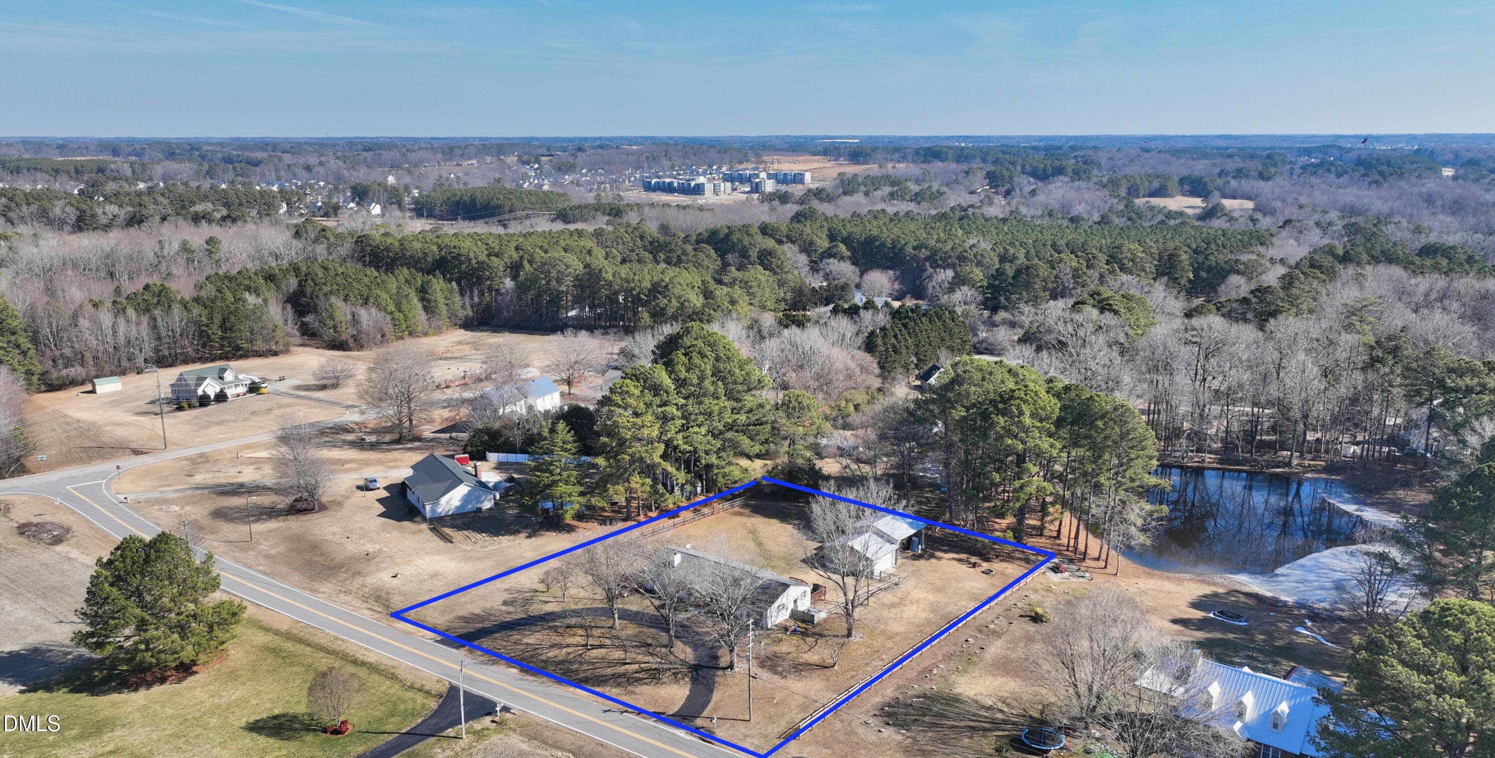 1009 Old Ferrell Road Knightdale, NC 27545 - Photo 29 of 42 an aerial view of a house with a yard and lake view