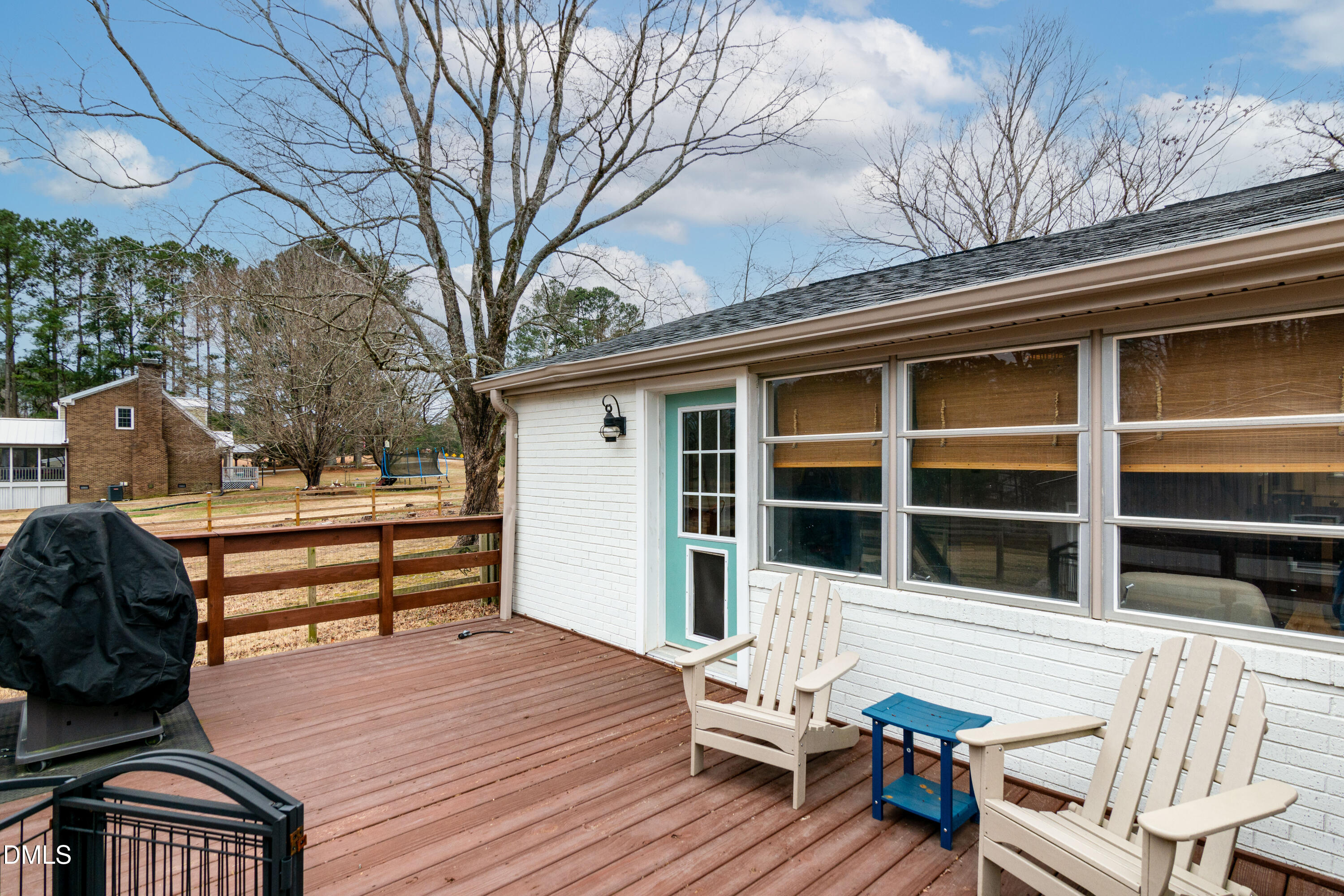 1009 Old Ferrell Road Knightdale, NC 27545 - Photo 31 of 42 a roof deck with table and chairs and wooden floor