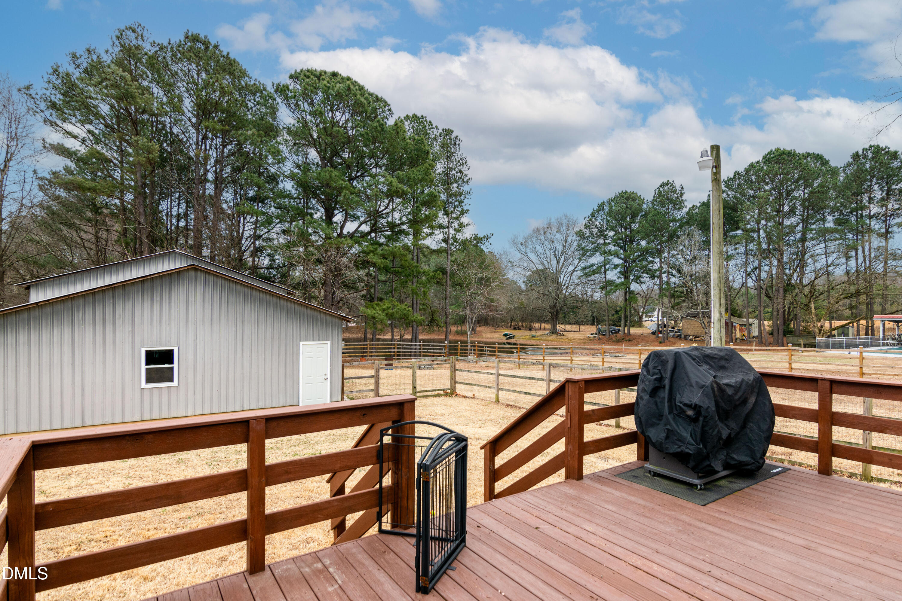 1009 Old Ferrell Road Knightdale, NC 27545 - Photo 33 of 42 a view of backyard with outdoor seating and wooden fence