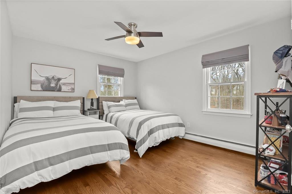 183 Frogtown Road New Canaan, CT 06840 - Photo 20 of 37 a bedroom with two beds and two windows