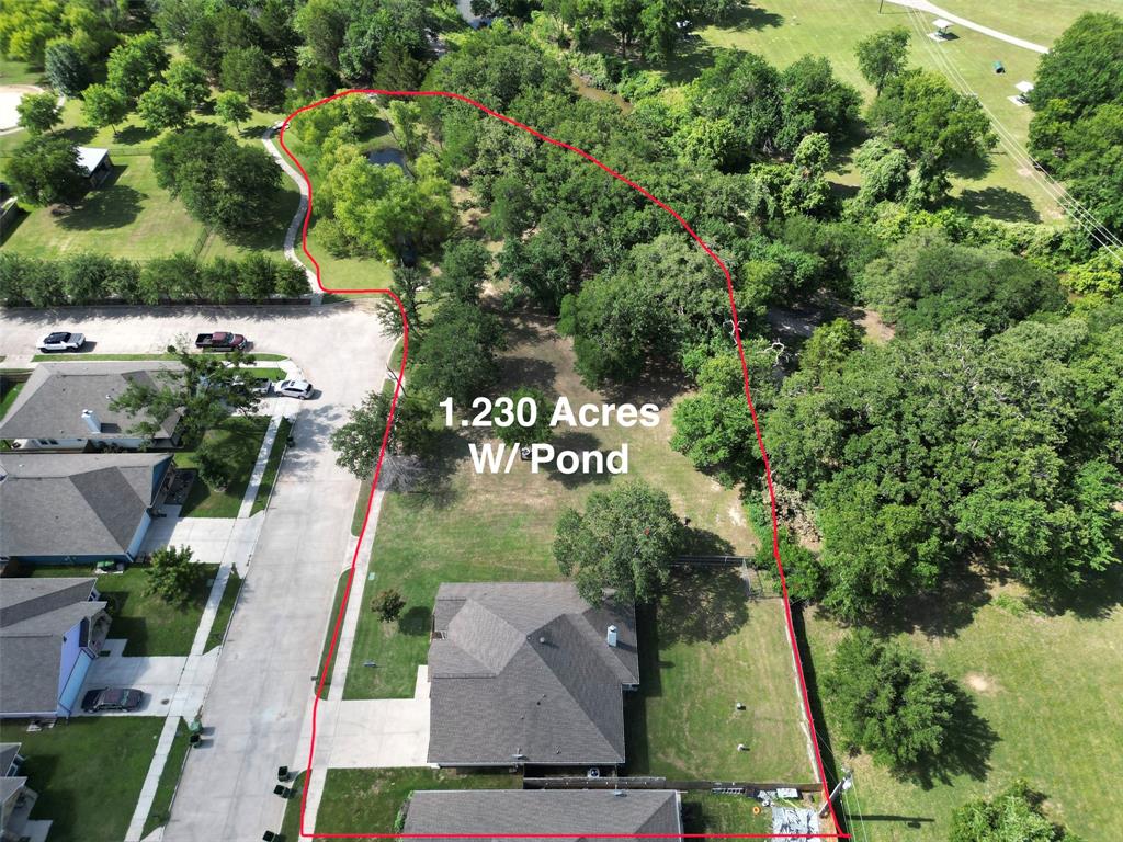 229 Firefly Drive Springtown, TX 76082 - Photo 27 of 33 Expansive 1.230-acre property featuring a private pond, mature trees, and ample green space