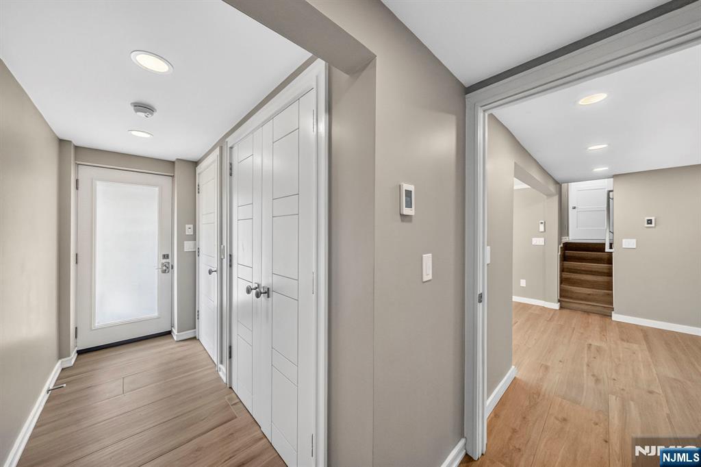 57 Hemlock Road Little Falls, NJ 07424 - Photo 24 of 50 a view of a hallway with wooden floor and closet area
