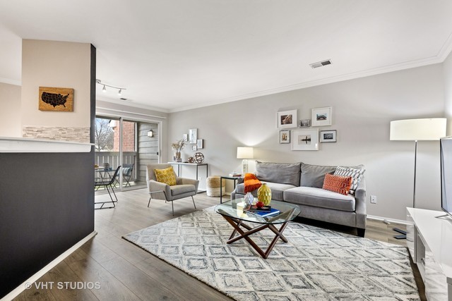 1630 Buttonwood Circle, Unit 3215 Schaumburg, IL 60173 - Photo 4 of 29 a living room with furniture and wooden floor