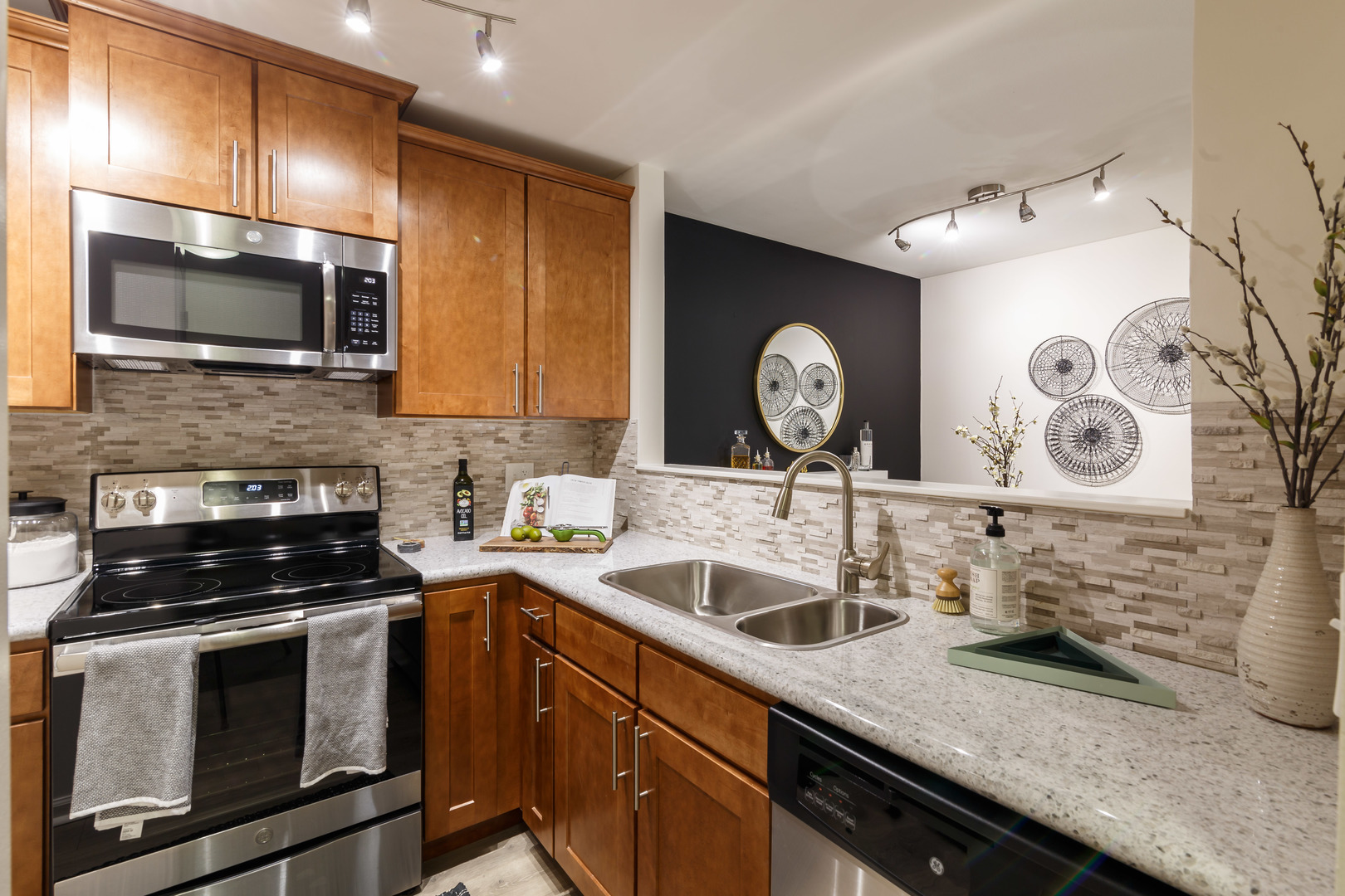 1630 Buttonwood Circle, Unit 3215 Schaumburg, IL 60173 - Photo 7 of 29 a kitchen with a sink stove and microwave
