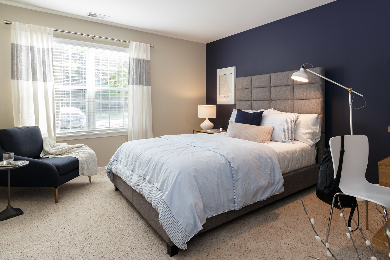 1630 Buttonwood Circle, Unit 3215 Schaumburg, IL 60173 - Photo 10 of 29 a bedroom with a bed and a chair