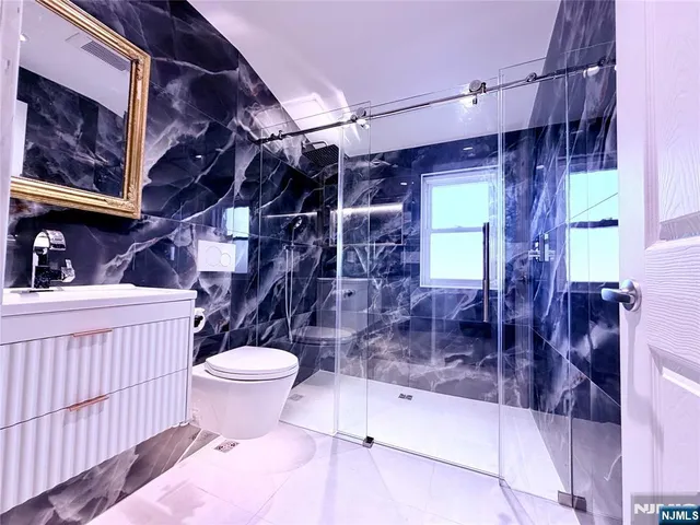 a bathroom with a bathtub and shower
