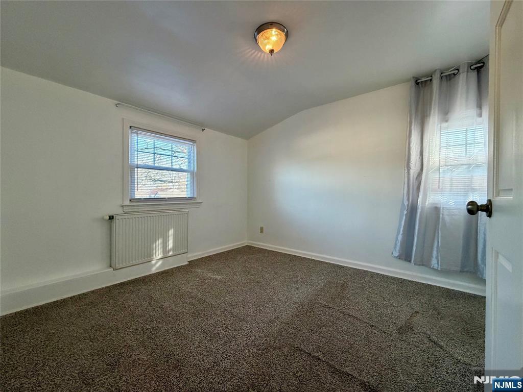 33 Homestead Place, Unit 2 Bergenfield, NJ 07621 - Photo 6 of 8 an empty room with windows