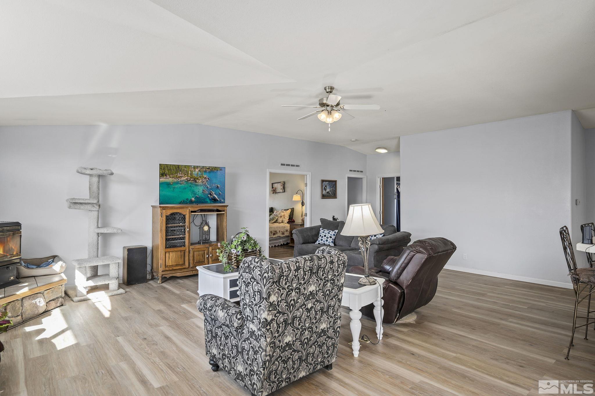 3880 Tree Farm Court Reno, NV 89510 - Photo 7 of 36 a living room with furniture and a wooden floor