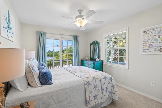 a bathroom with a granite countertop sink a toilet and a mirror