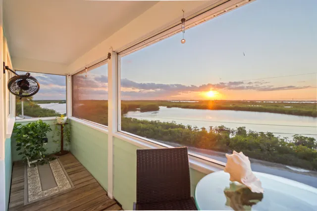 a wooden deck with a lake view
