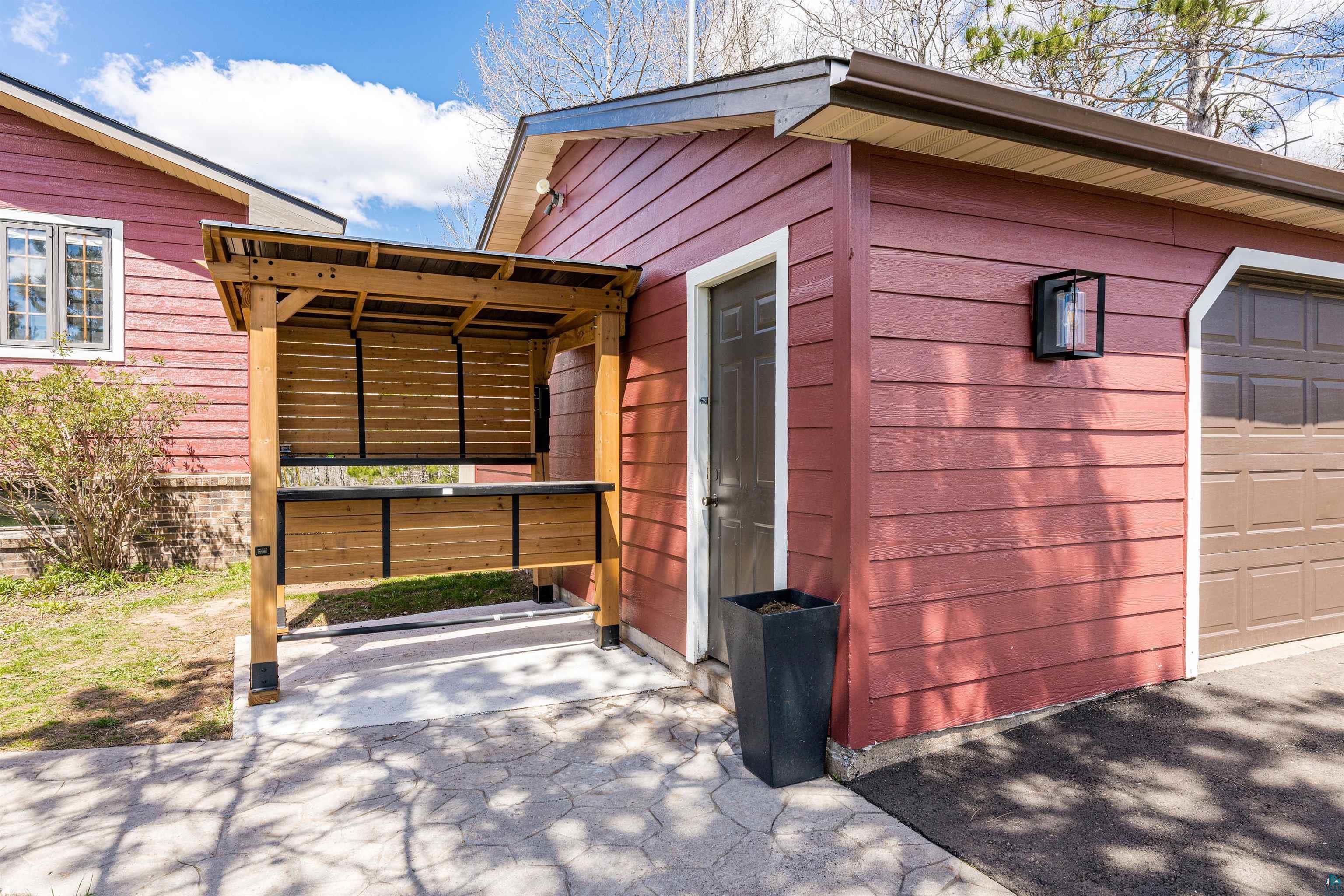 3325 Strand Road Duluth, MN 55803 - Photo 7 of 25 Detached garage with creatively attached timber built Gazebo grilling station.