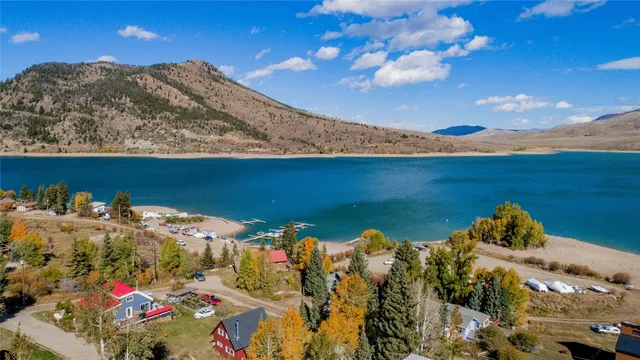 a living room with furniture a window and a clock