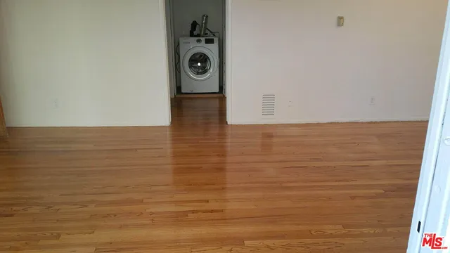 a kitchen with granite countertop a refrigerator and a stove