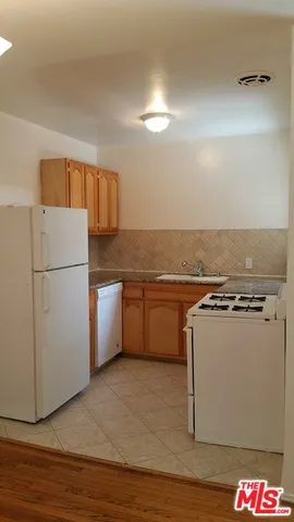 a view of wooden floor and brick walls