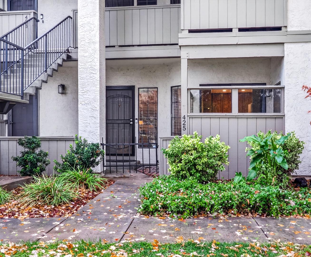 a front view of a house with garden