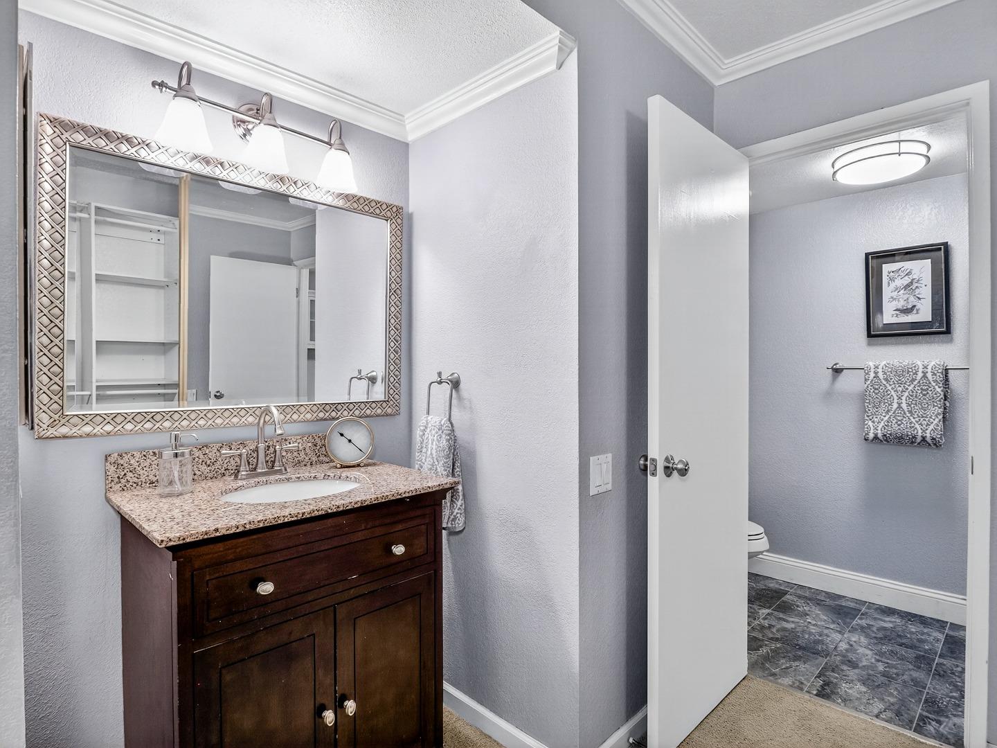 425 Kenbrook Circle San Jose, CA 95111 - Photo 25 of 46 a bathroom with a sink vanity and a mirror