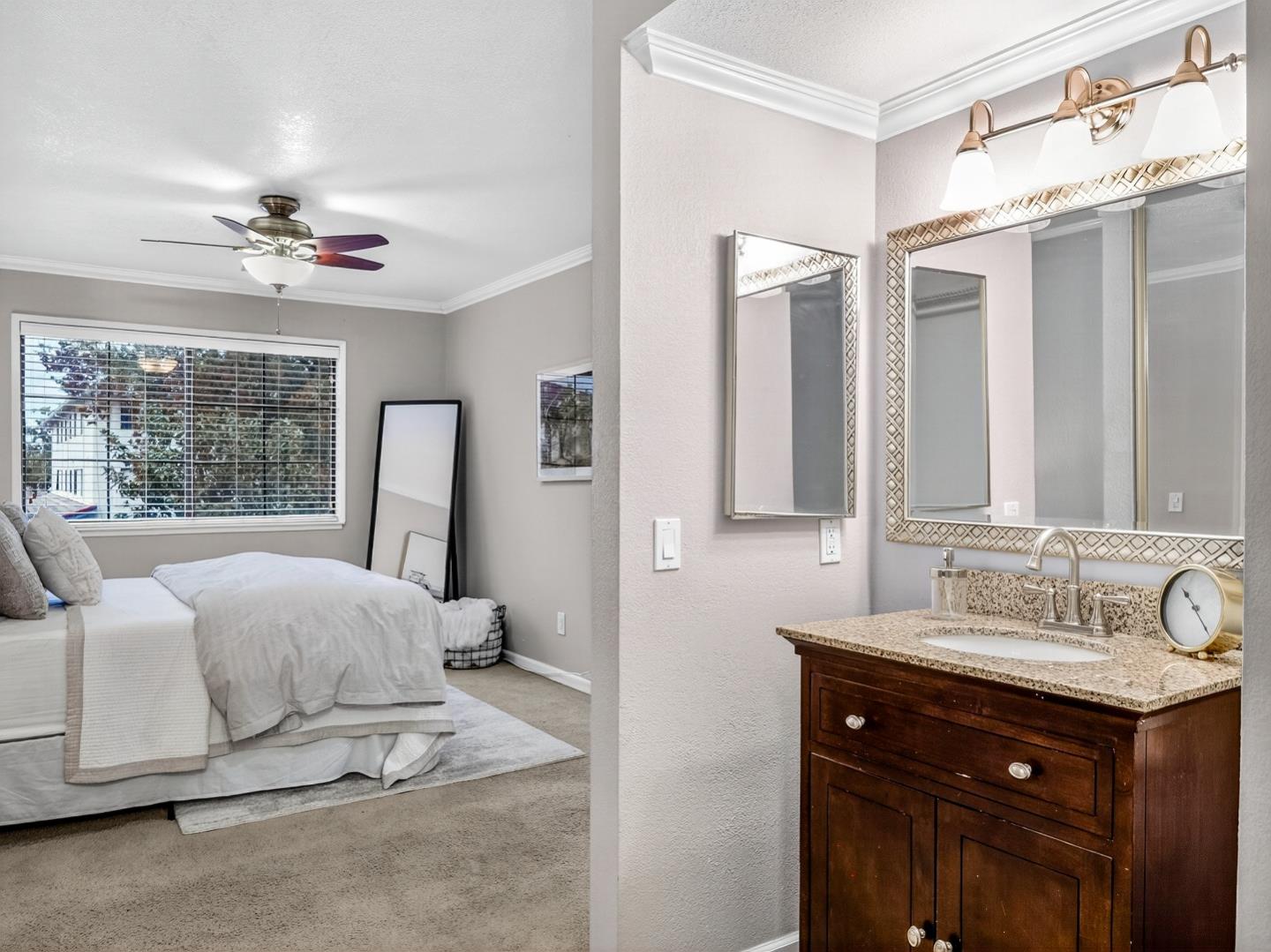 425 Kenbrook Circle San Jose, CA 95111 - Photo 27 of 46 a bedroom with a double vanity sink and a mirror
