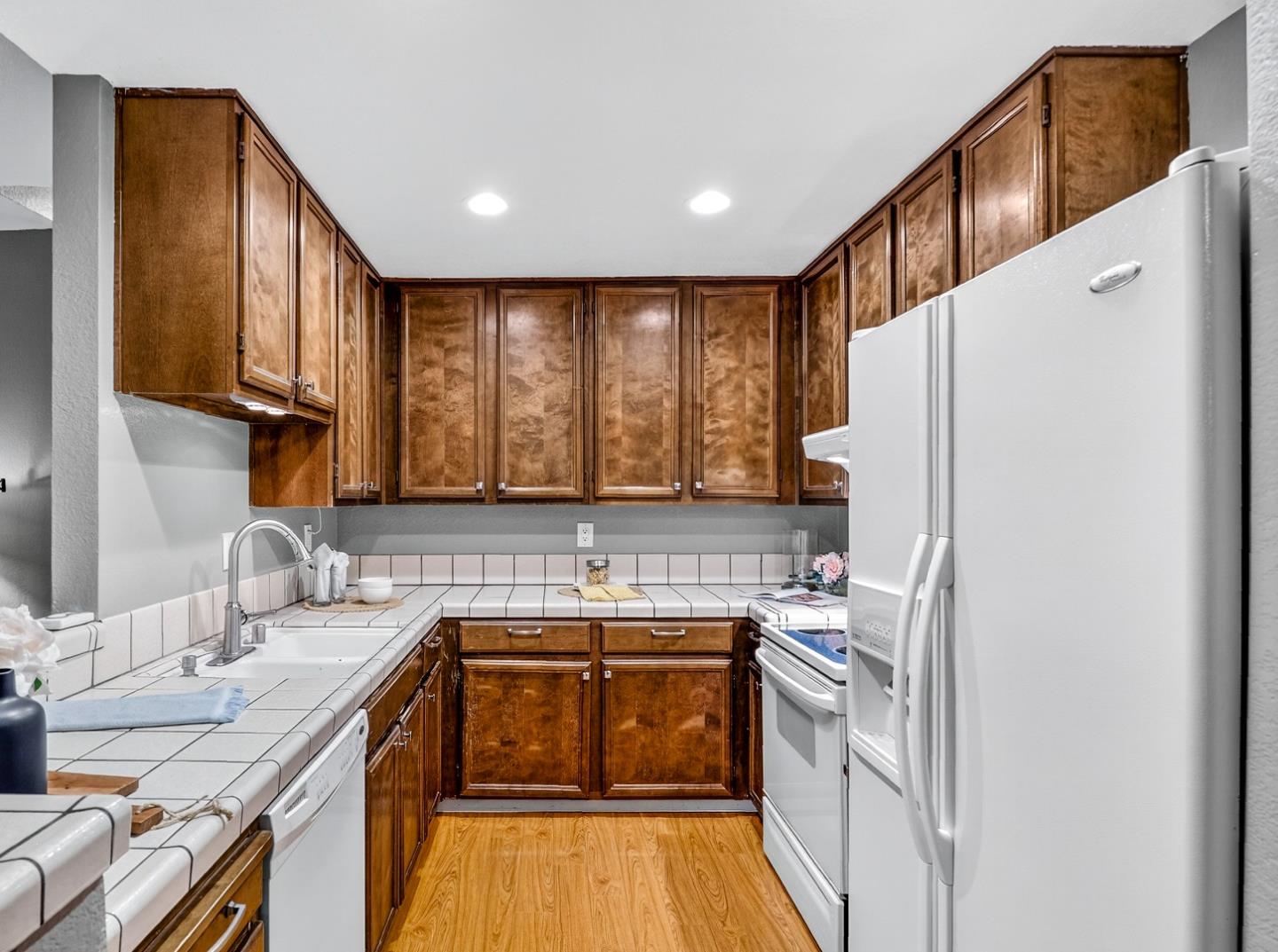 425 Kenbrook Circle San Jose, CA 95111 - Photo 6 of 46 a kitchen with a sink a stove a refrigerator and a microwave
