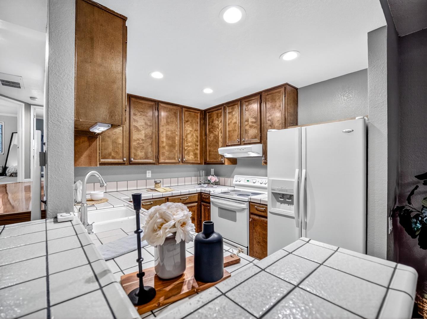 425 Kenbrook Circle San Jose, CA 95111 - Photo 8 of 46 a kitchen with stainless steel appliances granite countertop a refrigerator and a stove top oven