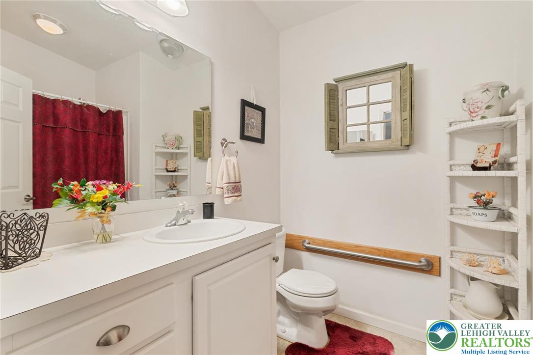 116 Allison Place Blandon, PA 19510 - Photo 12 of 24 a bathroom with a sink a toilet and a mirror