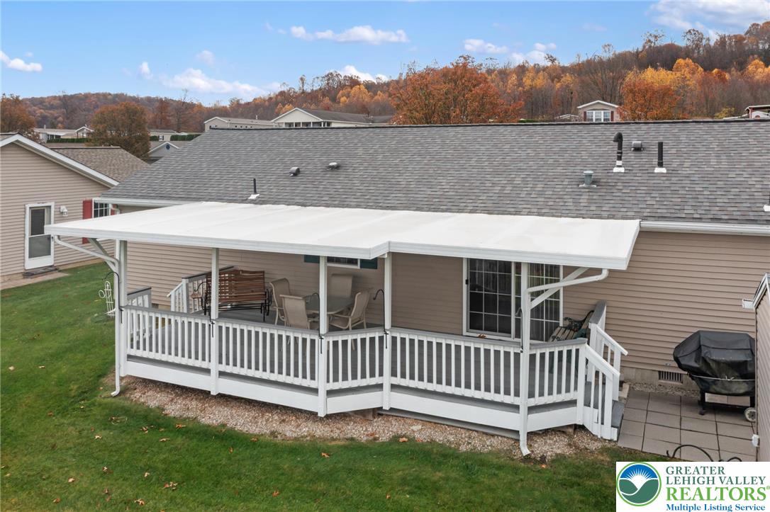 116 Allison Place Blandon, PA 19510 - Photo 21 of 24 a view of a house with a deck and a yard