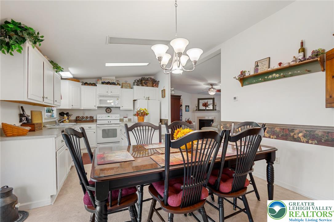 116 Allison Place Blandon, PA 19510 - Photo 8 of 24 a view of a dining room with furniture and chandelier