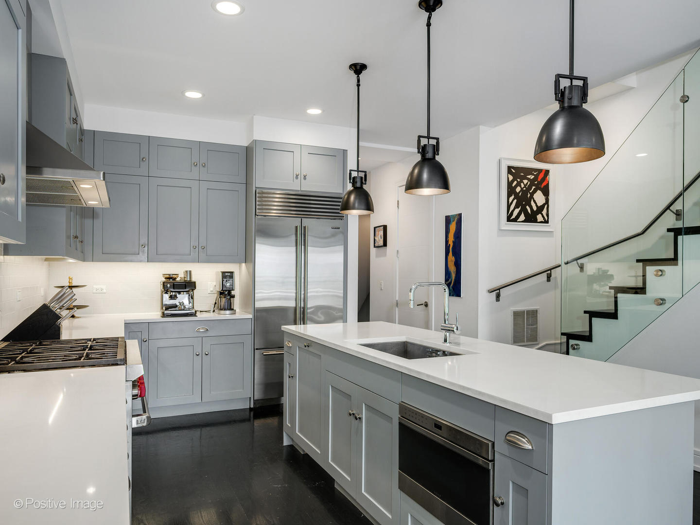 2922 North Sheffield Avenue, Unit 3 Chicago, IL 60657 - Photo 11 of 28 a kitchen with stainless steel appliances kitchen island a stove a sink and a refrigerator