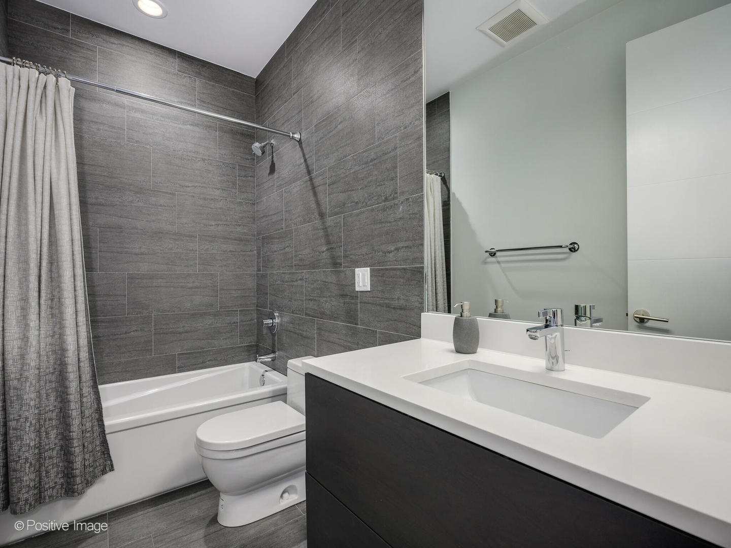 2922 North Sheffield Avenue, Unit 3 Chicago, IL 60657 - Photo 16 of 28 a bathroom with a sink a toilet and shower