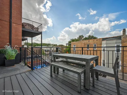 a view of a balcony with wooden floor