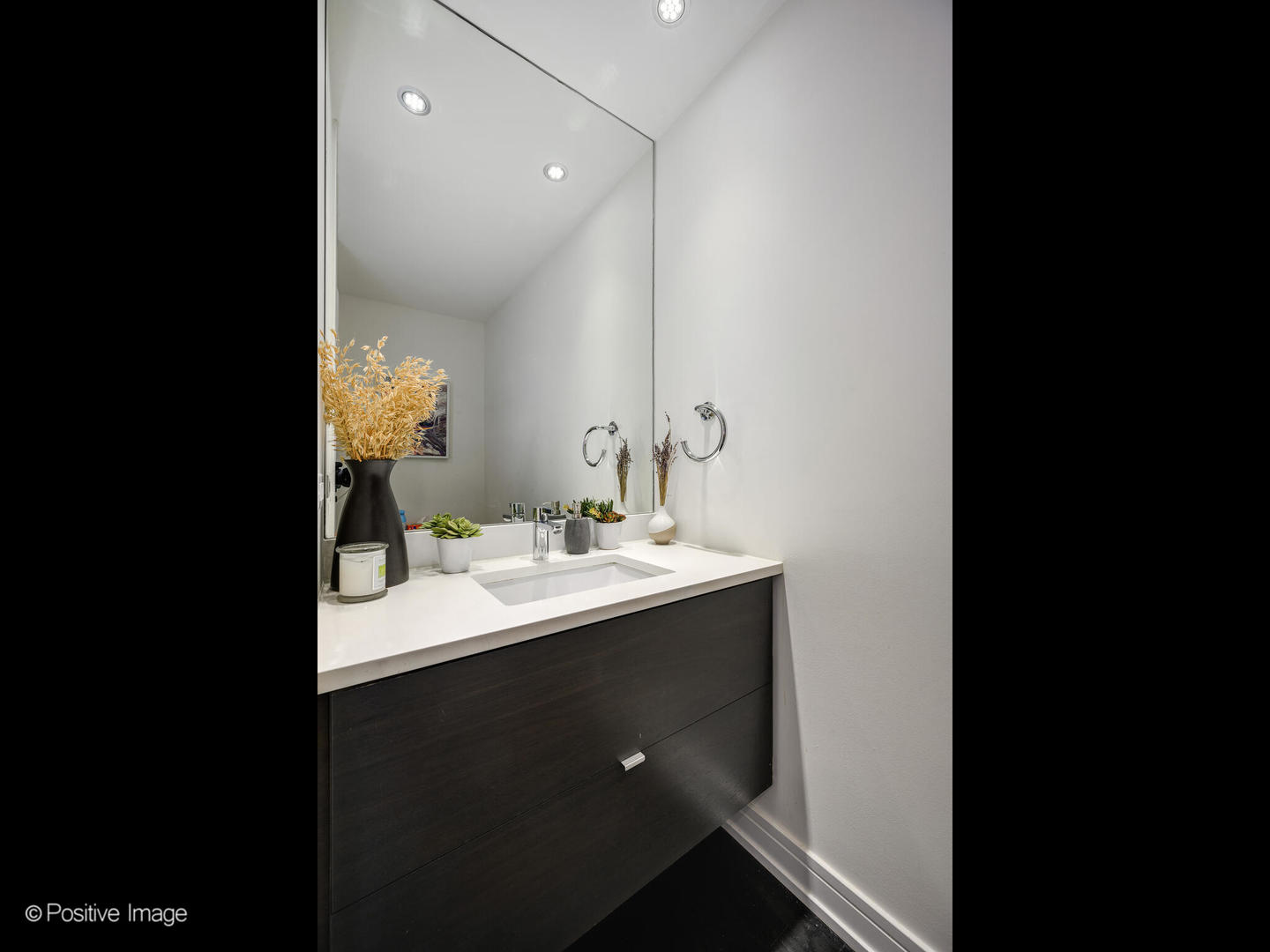 2922 North Sheffield Avenue, Unit 3 Chicago, IL 60657 - Photo 8 of 28 a bathroom with a sink and a mirror
