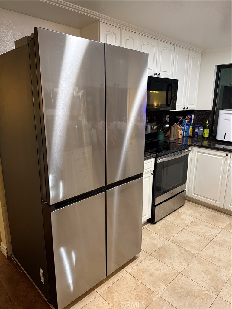 5 Fasano Irvine, CA 92620 - Photo 4 of 10 a kitchen with stainless steel appliances granite countertop a refrigerator and a sink