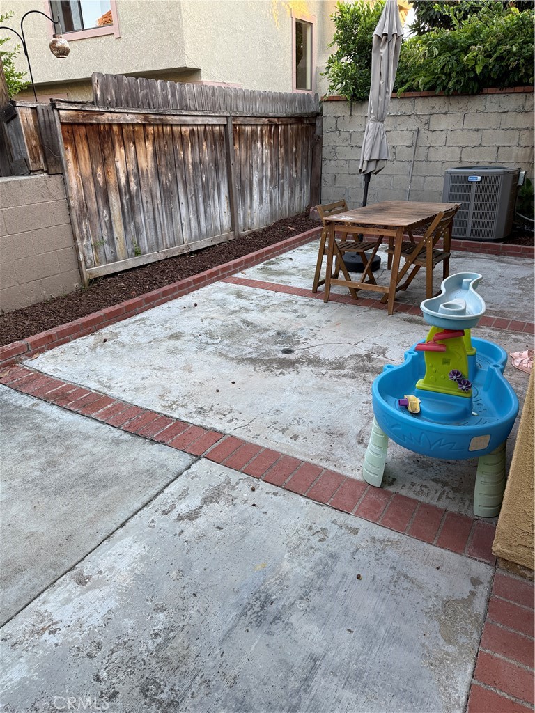 5 Fasano Irvine, CA 92620 - Photo 9 of 10 a view of a backyard with wooden fence