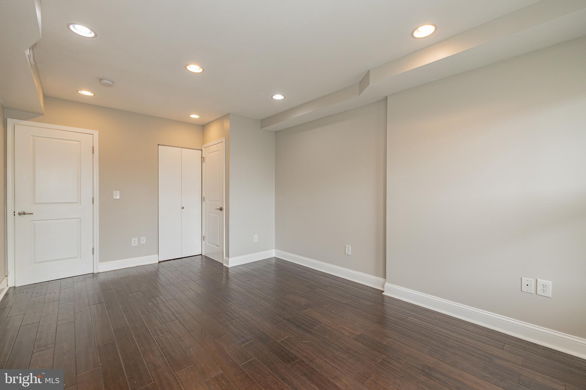 1815 Benning Road Northeast, Unit 2 Washington, DC 20002 - Photo 8 of 12 a view of an empty room with wooden floor