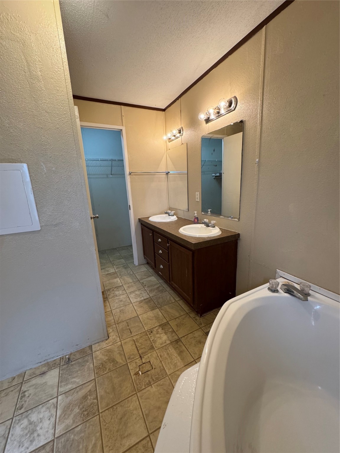 1810 Connorvale Road Houston, TX 77039 - Photo 15 of 23 a bathroom with double sink and mirror