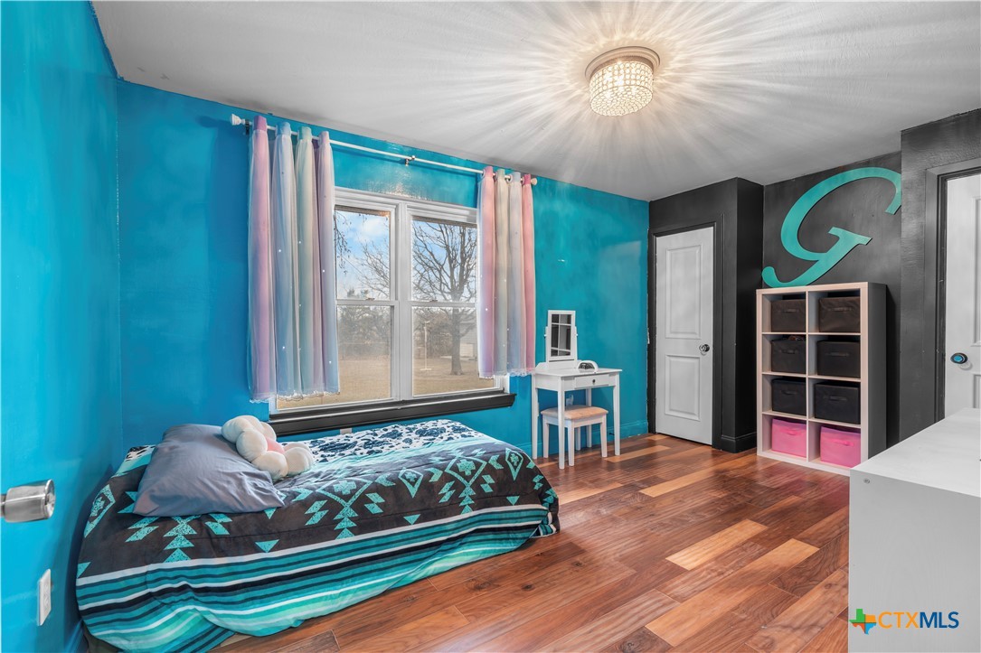 308 Liberty Street Gatesville, TX 76528 - Photo 19 of 41 a bed room with a bed and a window