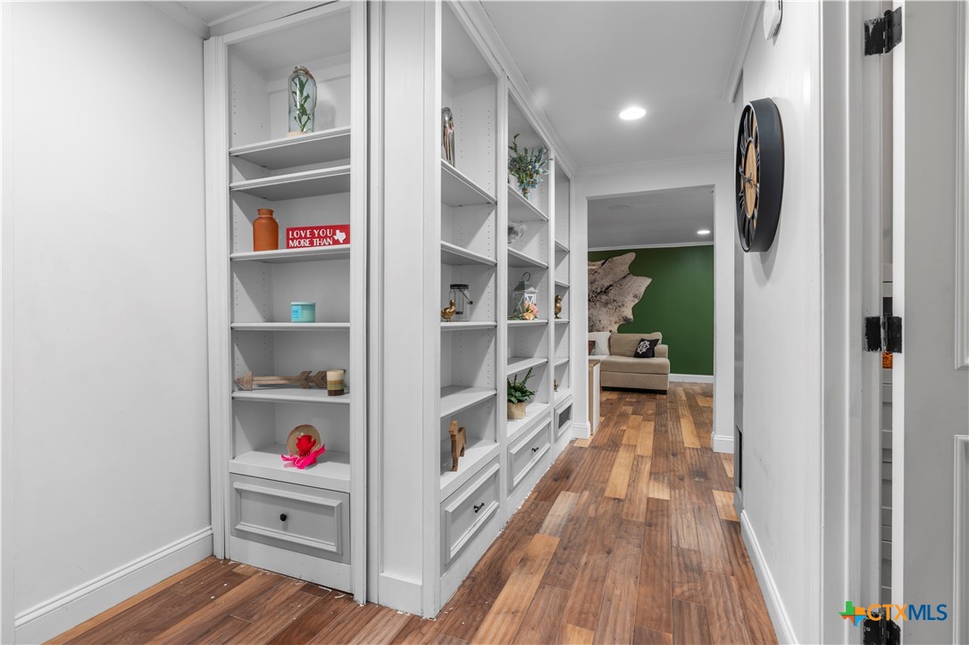 308 Liberty Street Gatesville, TX 76528 - Photo 25 of 41 a view of walk in closet with clothes and shoes