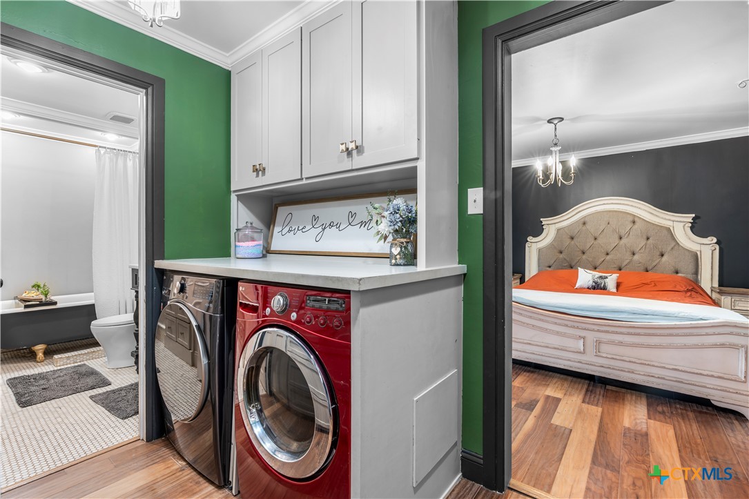 308 Liberty Street Gatesville, TX 76528 - Photo 26 of 41 a utility room with dryer and washer